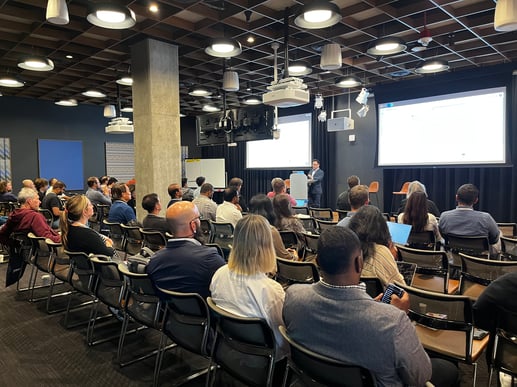 Promevo leads a large Gemini AI deployment workshop in a large conference room