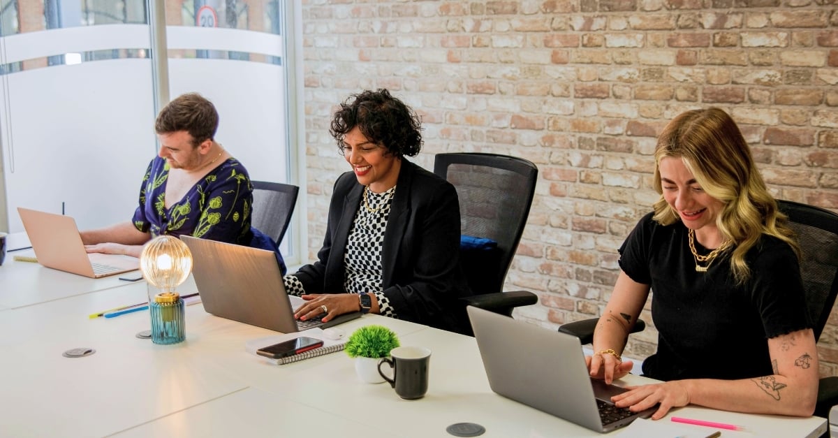 A group of a young professionals work at a conference table 