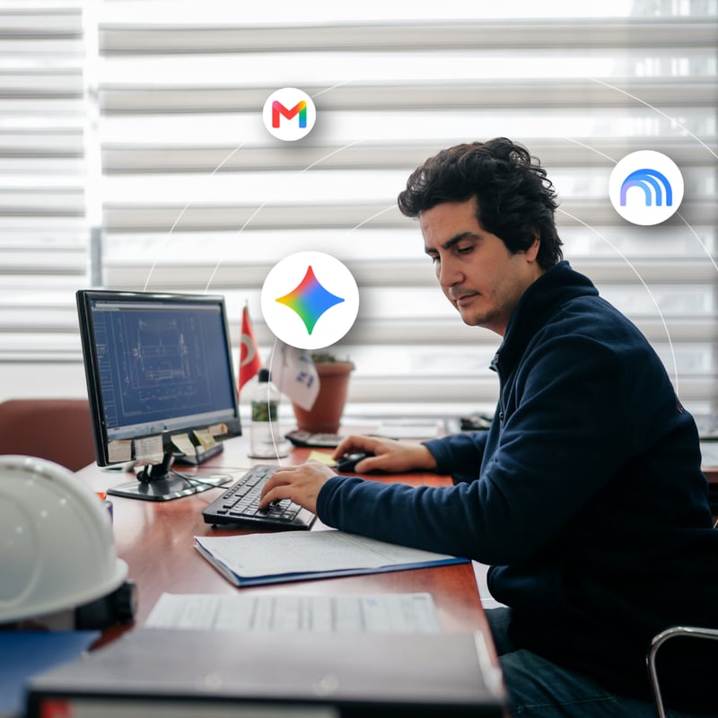 A man reviews information on his desktop computer