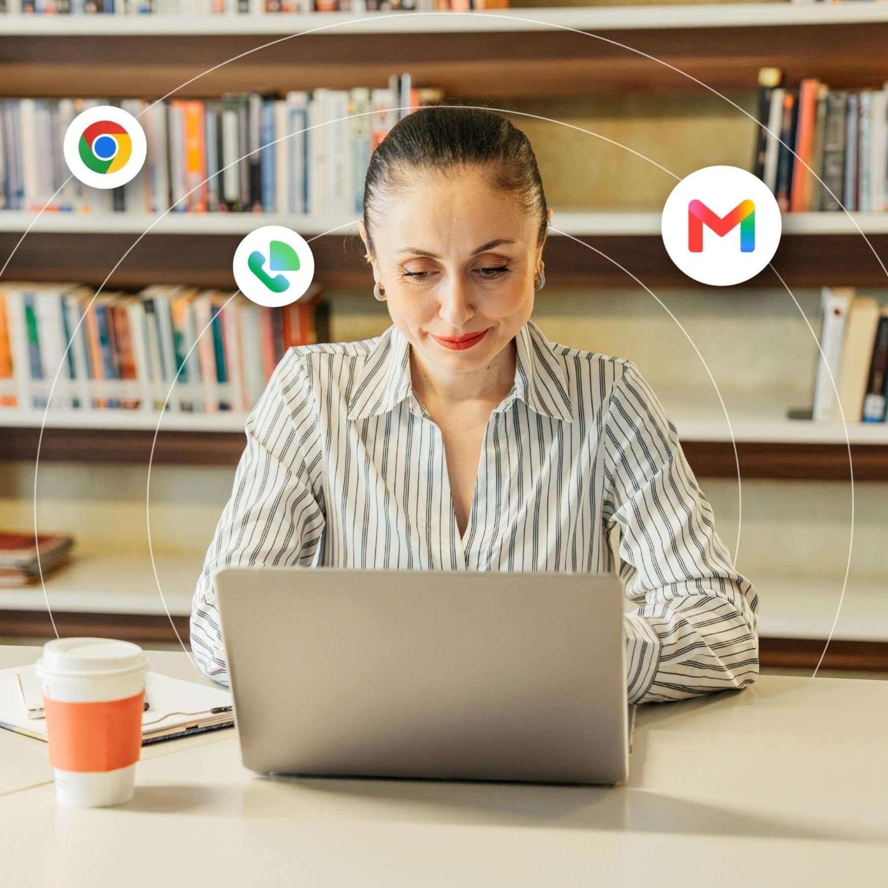 A teacher works from her laptop in the school library