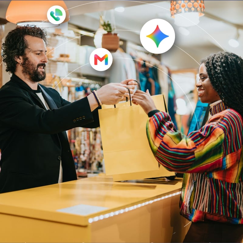 A retailer hands a shopping bag over to a customer